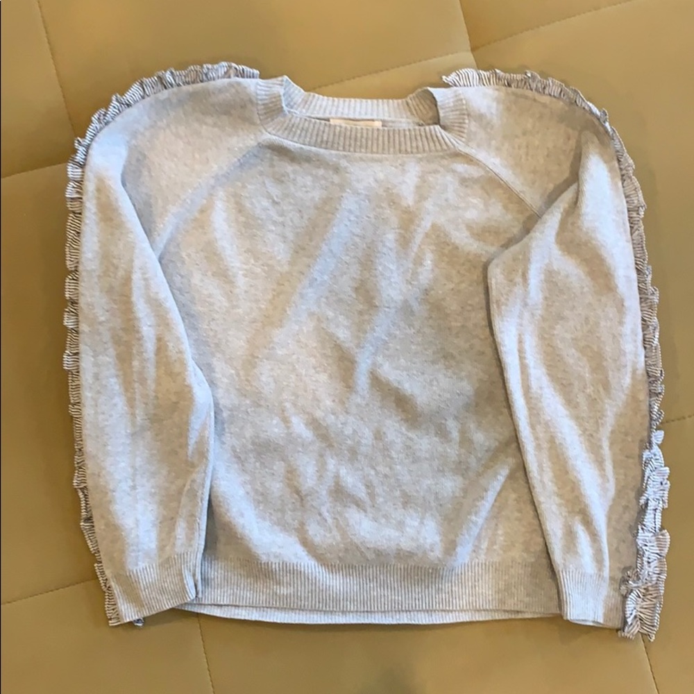 Sweater with ribbon detail on sleeve. Like new